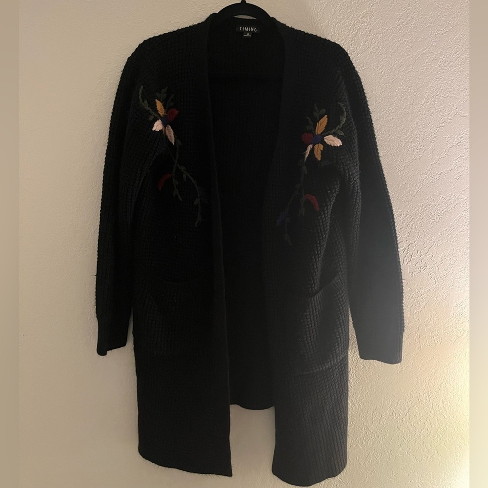 Black sweater cardigan with floral details